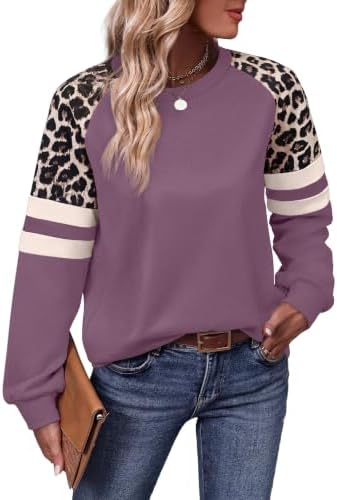 Patterned sleeves in a muted leopard print frame a soft purple body, cut long enough to pull straight over leggings.
