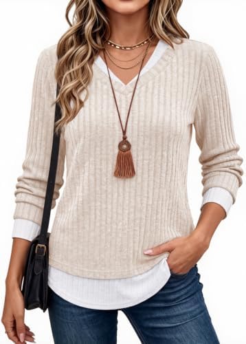A soft rib-knit tunic in warm pure apricot, finished with an integrated contrast insert that creates a clean layered look.
