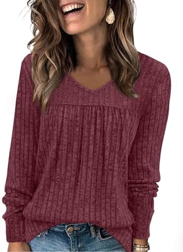 A deep purple red ribbed knit tunic with front pleats and a classic V-neckline for easy layering when the weather cools down.