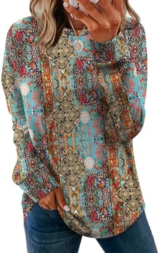 A detailed ethnic print accents this soft crewneck tunic cut with a curved hem and small side slits for everyday ease.