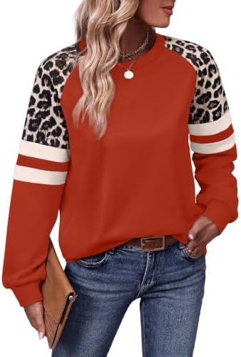 A bright red bodice meets patterned leopard sleeves on this lightweight crewneck tunic cut with plenty of room through the hips.