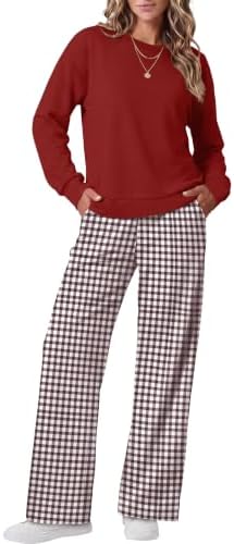 A rich burgundy and brown plaid pattern covers this two-piece set, featuring a crewneck top and breezy wide-leg pants.