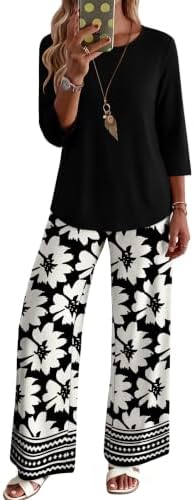 Crisp black and white florals bring clear contrast to this soft knit set, cut with three-quarter sleeves and deep pant pockets.