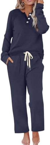 Cut in deep dark blue, this two-piece knit set pairs a button-front henley top with wide-leg drawstring pants for cool days.