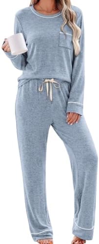 Crisp white piping traces our soft light blue knit lounge set, pairing a long sleeve pocket top with relaxed wide leg pants.
