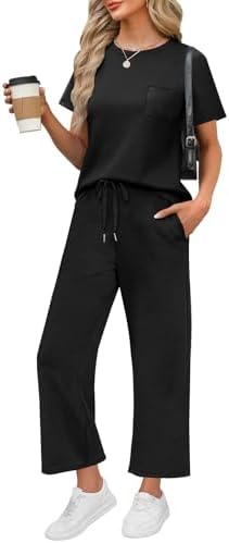 A jet black two-piece set cut from silky, four-way stretch spacer fabric with wide-leg cropped pants.