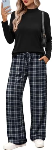 A graphic black checkered print sharpens this relaxed two-piece set, cut with a clean mock neck and roomy wide legs.