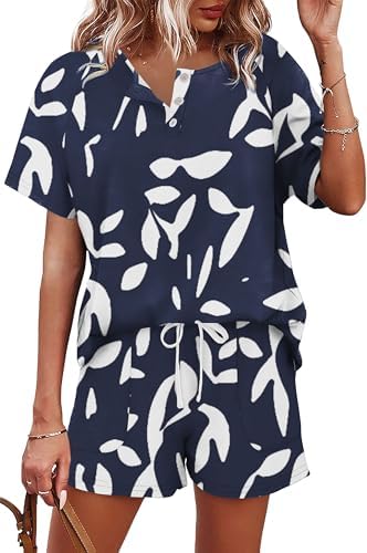 Navy blue floral print covers this breezy two-piece set, pairing a buttoned henley tee with easy drawstring pocket shorts.