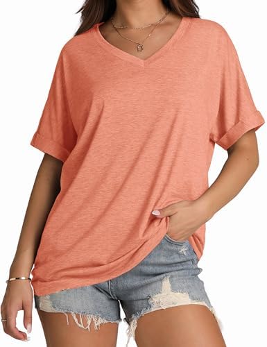 A relaxed coral knit tee cut with rolled cuff sleeves and a neat V-neck for warm summer mornings.
