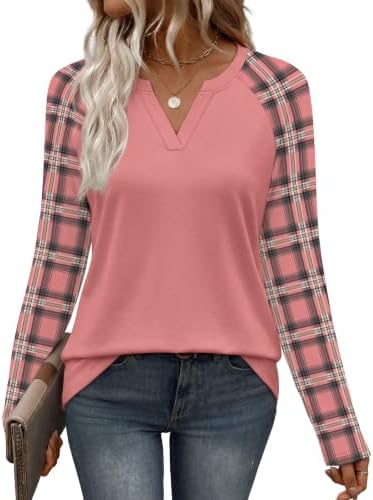 Soft pink plaid panels bring a cheerful pattern break to this long-sleeve knit top cut with easy raglan sleeves.