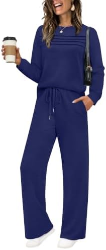 Soft navy blue knit pairs a pleat-front long sleeve top with wide-leg drawstring pants for relaxed travel days.