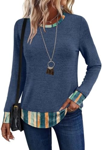 Vertical blue stripes accent the lower hem on this soft knit tunic, cut long for easy pairings with leggings or classic denim.