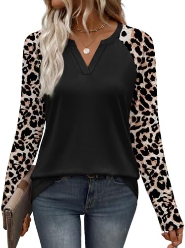 Raglan sleeves cut in spotted print frame this black knit top, shaped with a neat V-neckline and a relaxed drape.