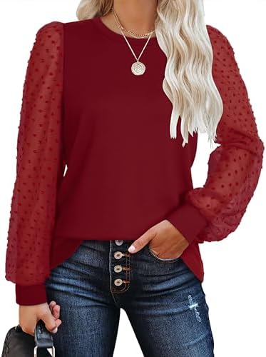 Vibrant red knit joins sheer dotted sleeves for an easy evening top that stands out against denim or skirts.