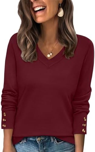 A deep wine red knit top cut with an open V-neckline and polished three-button cuffs for cool evenings.