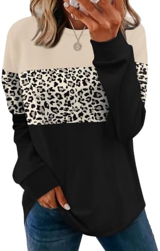 Soft beige leopard spots bring subtle pattern to a lightweight tunic sweatshirt cut with a curved hem and side slits.