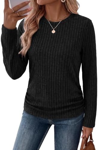 Ribbed black knit with gathers along each side seam creates an easy longer layer for breezy mornings and chilly desks.