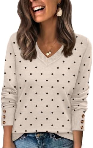 A playful polka dot pattern meets a wide V-neckline and decorative button cuffs on this soft knit pullover.