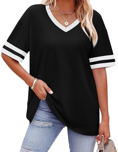 Striped cuff bands add crisp detail to this roomy black summer top cut from a breathable, stretchy knit blend.
