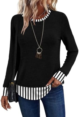 A crisp striped contrast hem peeks out beneath solid black knit, giving this soft long sleeve top a tidy layered look.