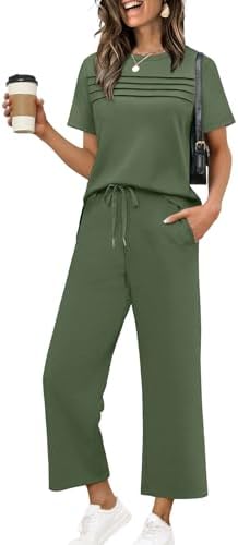 A rich green two-piece set cut from silky spacer fabric, pairing a pleated short-sleeve top with breezy wide-leg crop pants.