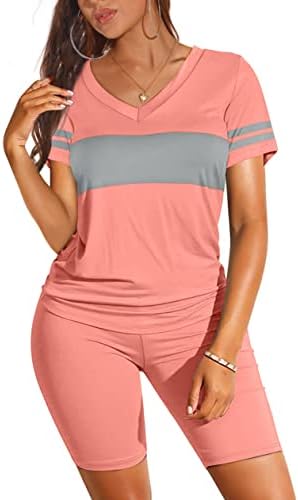 Cut in bright coral pink, this two-piece set pairs a classic V-neck top with high-waist biker shorts for summer days.