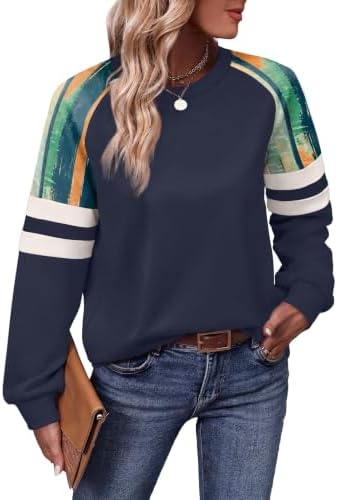 Bold blue color blocking pairs with vibrant striped accents on the sleeves of this lightweight crewneck tunic pullover.