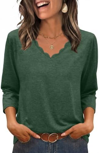 Cut in a lush green knit, this top combines scalloped neckline detail with three-quarter sleeves and an easy curved hem.
