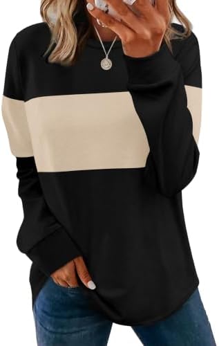 A soft beige knit pullover cut with a sweeping curved hem and side slits for easy layering over your favorite leggings.