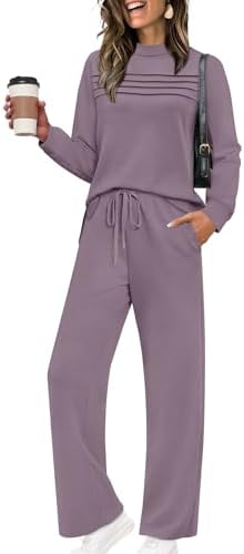 Spun from drapey spacer knit in muted grey purple, this two-piece set pairs a long-sleeve slit top with cropped wide-leg pants.