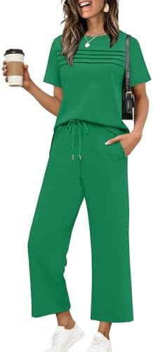 Cut from drapey spacer knit, this vivid green two-piece set pairs a slit short-sleeve top with wide cropped pants.