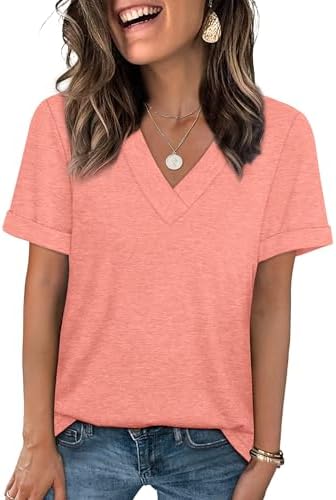 A bright coral knit tee with a neat V-neck and rolled cuffs that pairs naturally with white denim, tailored slacks, or shorts.