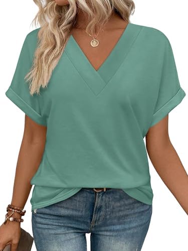 A cool green blue knit tee with rolled sleeves and a relaxed cut that knots or tucks easily.