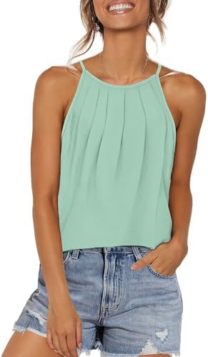 A cool lake green tank with front pleating and slim straps, cut long enough to pair over leggings.
