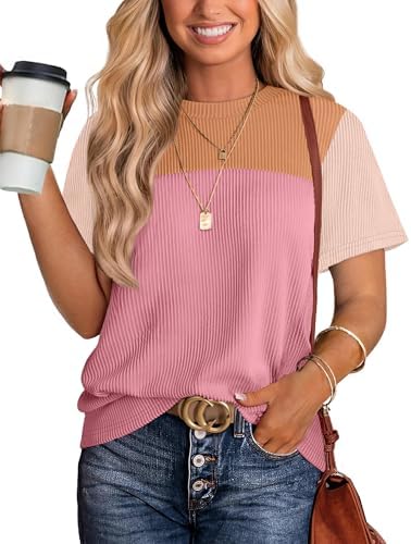 A soft light pink ribbed knit top cut loose through the body with short sleeves and a classic round neck for warm days.