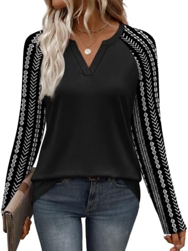 Black stripes meet solid contrast raglan sleeves on this long sleeve tunic cut with plenty of room through the body.