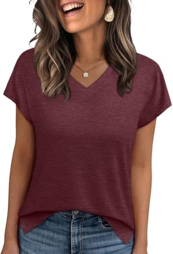 A deep rust red tee cut loose through the body with clean cap sleeves, a neat v-neck, and side splits at the hem.
