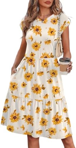 Bright yellow petals scatter across an ivory base on this tiered summer swing dress cut with side pockets.