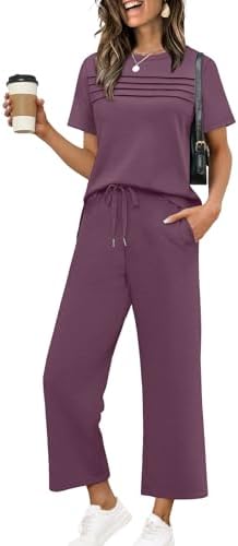 A deep dark purple two-piece set cut from silky, four-way stretch spacer knit with a slit top and cropped wide legs.