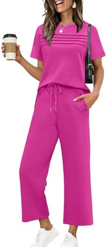 Hot pink spacer knit shapes this airy two-piece set, combining a front-pleated short sleeve top with cropped wide-leg pants.