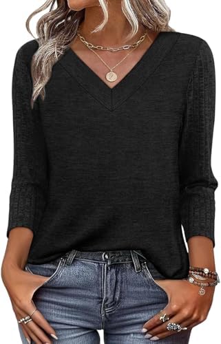 A soft black tunic with three-quarter sleeves and a clean V-neck that layers smoothly under an office blazer or light cardigan.