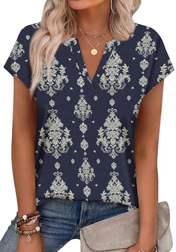 A notched V-neck top in deep navy with an intricate ethnic print, cut with cap sleeves for warm summer days.