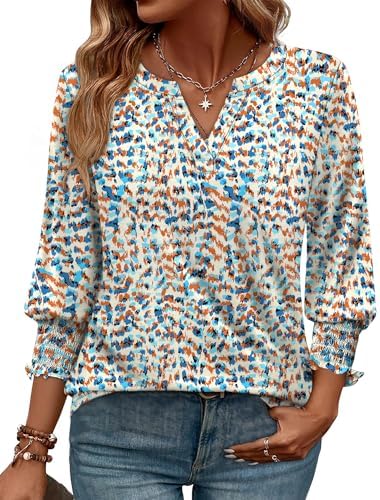 A crisp blue and white floral print covers this lightweight blouse, tailored with a curved hem and gently gathered three-quarter sleeves.