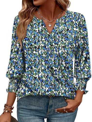 A crisp floral blue print enlivens this airy three-quarter sleeve top, cut with a clean V-neck and a curved shirttail hem.
