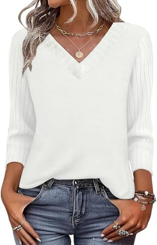 A bright white knit top with a neat V-neckline and flowy patchwork three-quarter sleeves that pair easily with dark denim.