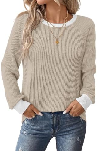 A soft beige vertical rib knit sweater with contrasting color block trim at the crew neck and cuffs for easy everyday layering.