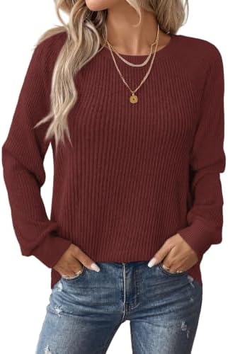 Bright fuchsia rib knit brings a bold pop of color to this soft crewneck pullover, cut loose for easy cool-weather layering.