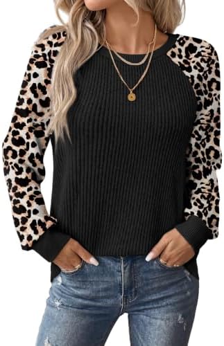 Spotted leopard patterning and solid ribbed trim give this lightweight raglan pullover an easy look for cooler days.