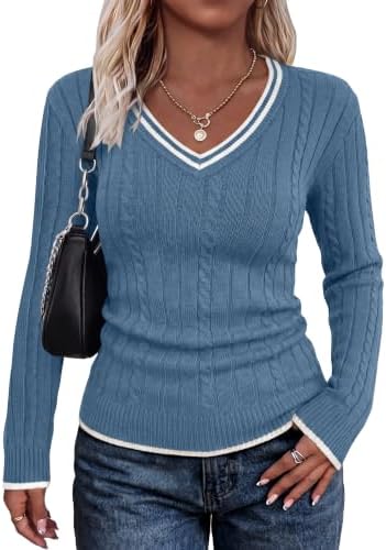 Crisp white tipping frames the cool blue body of this cable knit sweater, cut close with long sleeves and an open V-neckline.