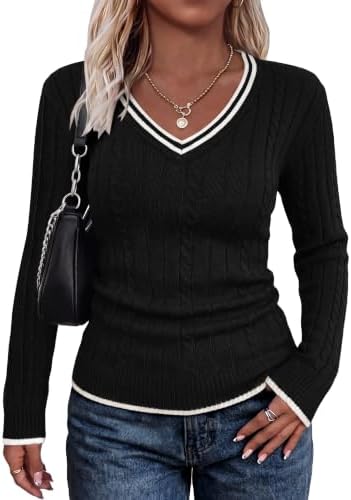 Contrasting white trim frames the deep V neckline and ribbed edges of this slim black cable knit pullover.